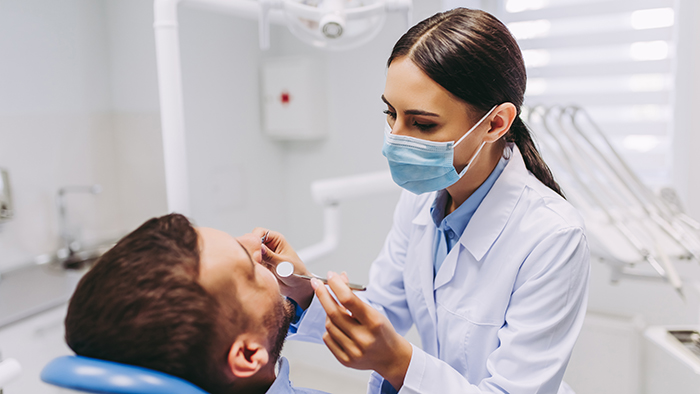 Dentist Checking Patient Teeth